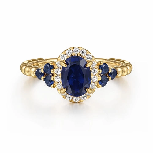 14K Yellow Gold Bujukan Diamond Halo and Oval Blue Sapphire Fashion Ring Glistening Piece Graceful Twist