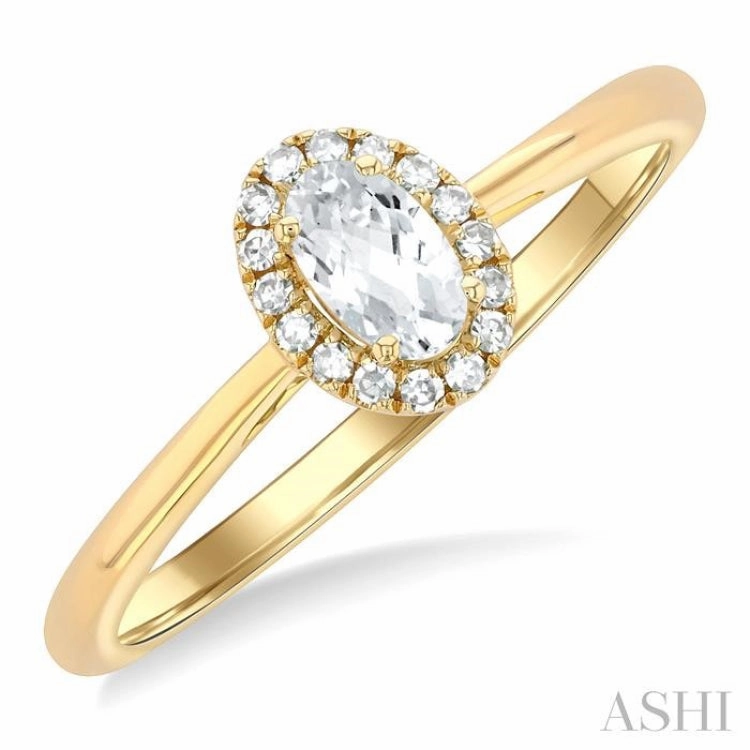 5x3 MM Oval Shape White Topaz and 1/20 Ctw Single Cut Diamond Halo Semi-Precious Ring in 10K Yellow Gold Ribbon Winner