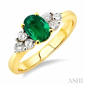 Quiet Style 7x5mm Oval Cut Emerald and 1/3 Ctw Round Cut Diamond Ring in 14K Yellow Gold