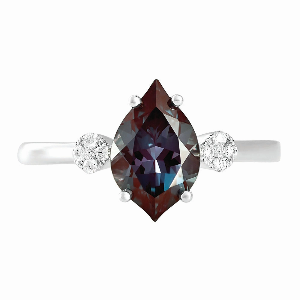 14K white gold ring featuring an 11x7mm flame-cut Chatham lab grown alexandrite and Chatham lab grown diamond accents. Opulent Sparkle Unique Spark