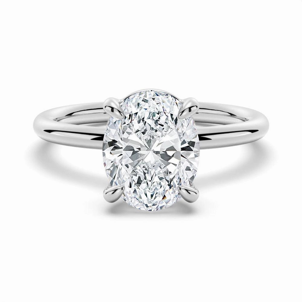 Four Prongs Oval Solitaire Moissanite Engagement Ring Close Up Timeless Match