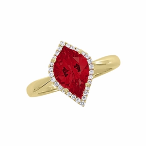 Gentle Look Occasion Accent 14K yellow gold ring with an 11x7mm flame cut Chatham lab grown ruby and Chatham lab grown diamond halo accents.