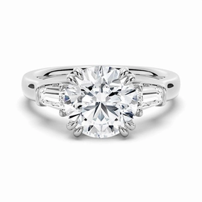 Contemporary Feel Round Cut Moissanite Engagement Ring with Tapered Baguette Side Stones