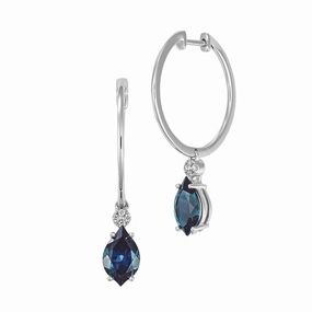 14K white gold hoop earrings featuring 10x6mm flame-cut Chatham lab grown alexandrite with Chatham lab grown diamond accents. Classic Pairing